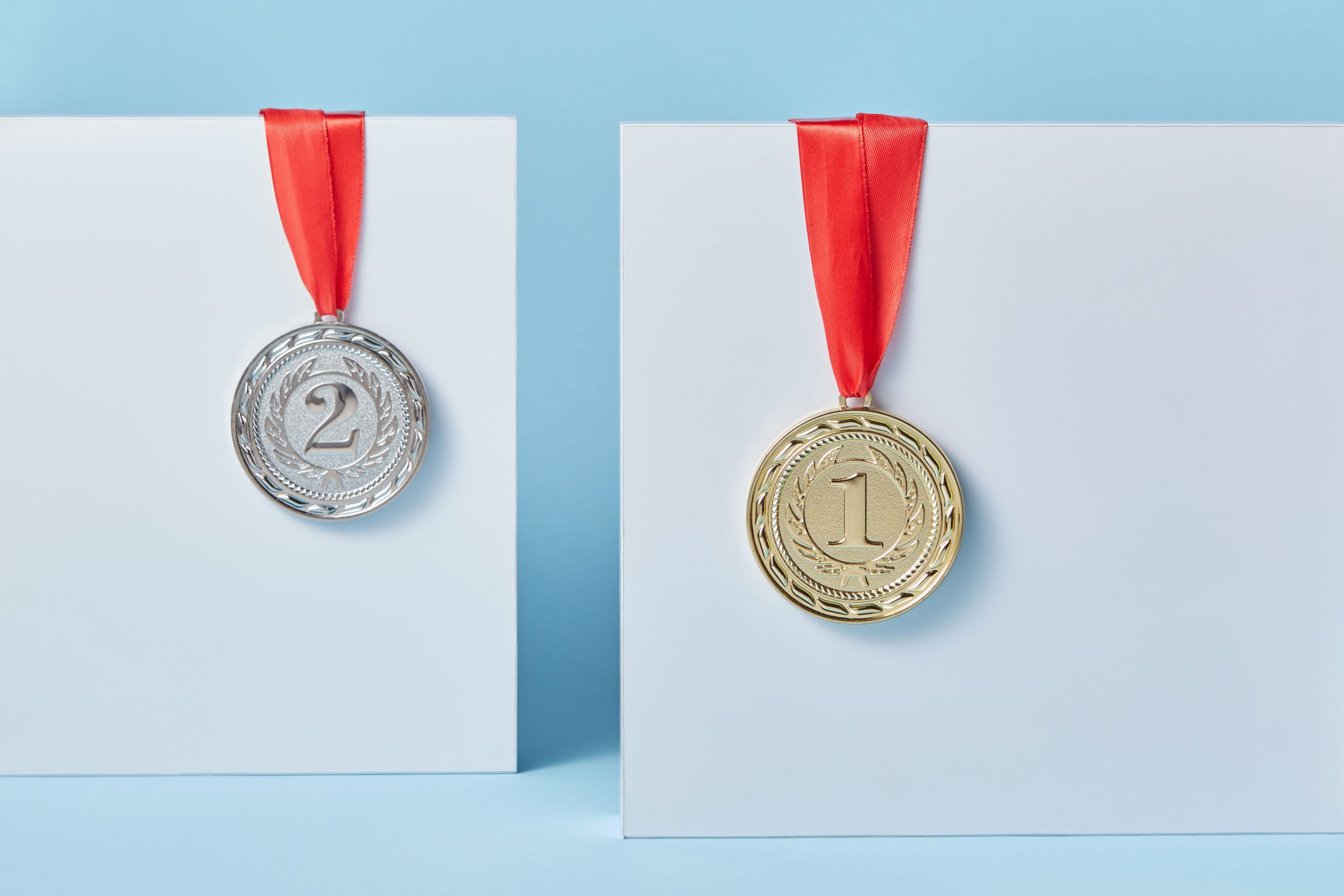 First and second place medals demonstrating how AI for small businesses gives a competitive advantage.